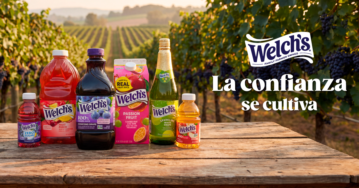 Línea de productos Welch's, incluyendo jugo de uva, fruit punch, uva blanca espumosa y parcha, sobre una mesa de madera en un viñedo. Incluye el logo de Welch's y el lema "La confianza se cultiva".